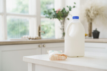 Bottle of milk on white wooden kitchen table