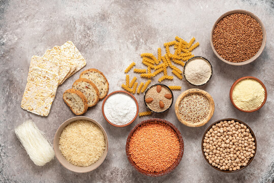 Selection of gluten free food on a rustic background. A variety of grains, flours, pasta, and bread gluten-free. Top view, flat lay.