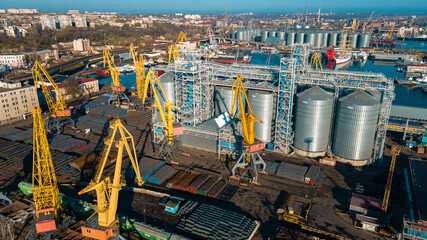 Industrial port in the field of import-export global business logistics and transportation, Loading and unloading container ships, cargo transportation from a bird's eye view.