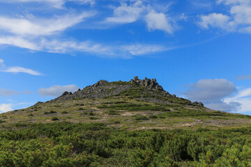 Fototapeta na wymiar The Stone Crown (Kamenny Venets) - a unique, naturally-occurring rock formation on the top of a hill, Magadan, Staritskogo peninsula