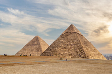 Fototapeta na wymiar The Pyramid of Khufu and the Pyramid of Khafre with dramatic sky in Egypt