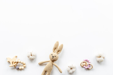 Obraz na płótnie Canvas Plush toy rabbit for newborn baby - background for baby shower
