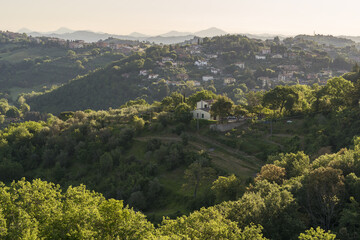 Obraz premium Panorama of the beautiful and green countryside of Perugia during sunrise, Umbria