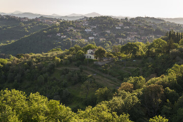 Fototapeta na wymiar Panorama of the beautiful and green countryside of Perugia during sunrise, Umbria