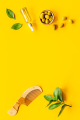 Hair treatment olive oil with hair comb. Top view