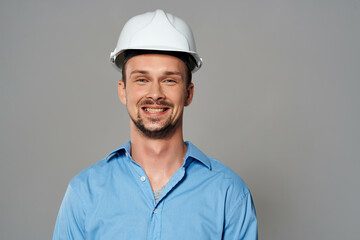 Cheerful male engineer construction helmet on his head safety work