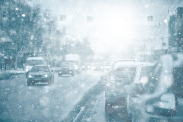 view of the winter road from the car, traffic in the seasonal city, bad weather in the northern city