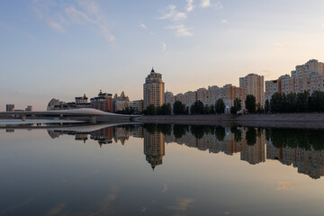 Fototapeta na wymiar View on Azirbaijan Mambetov street from Karaotkel bridge at sunrise time. Nur-Sultan, Kazakhstan.