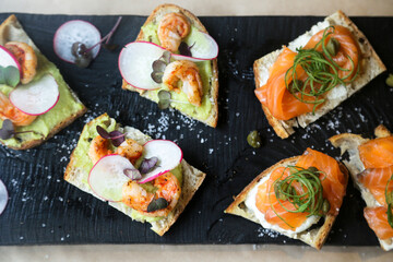 Healthy bruschetta with salmon and shrimps