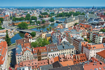 Fototapeta na wymiar old european polish city Wroclaw from above, aerial view on city center and bridges through the river