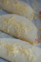 Cooking quesadilla with cheese and ham