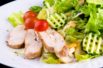 Salad with baked chicken breast for a healthy diet