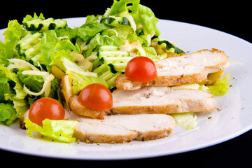 Salad with baked chicken breast for a healthy diet