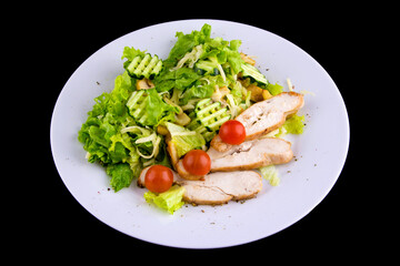 Salad with baked chicken breast for a healthy diet