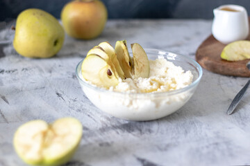cottage cheese dessert with apples and syrup on a light background
