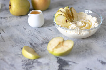 cottage cheese dessert with apples and syrup on a light background