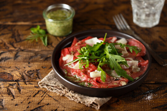 Traditional homemade beef carpaccio with arugula