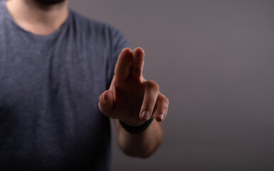Businessman pointing or touching finger in screen..