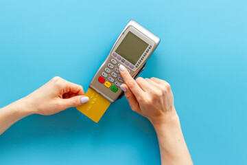 Hand paying by card with pos payment terminal. Payment transactions concept