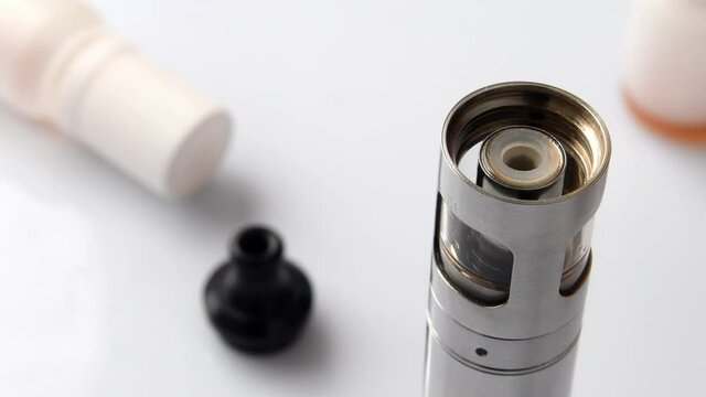Filling the tank of an electronic cigarette with liquid