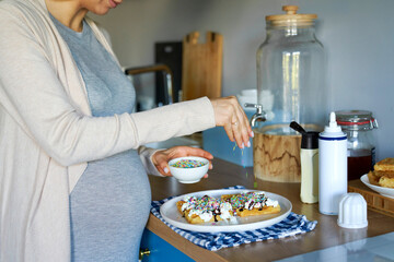 Prengat woman making unhealthy snakcs