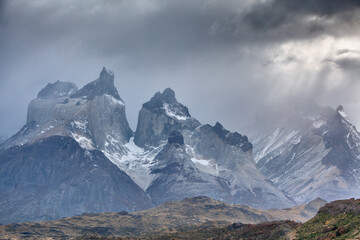 Fototapeta na wymiar Bad weather over the famous mountain peaks of Los Cuernos (The Horns) in Torres del Paine National Park, Patagonia 