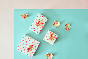 Different colored gift box on color background.