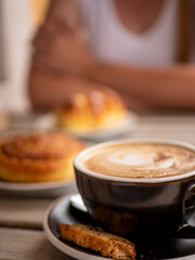 Breakfast at the cafe bakery with a woman in the background