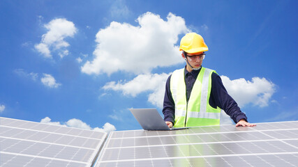 Asian engineer for solar panel inspection roof construction. Engineer worker installing solar panels outdoors