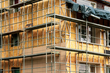 Insulation of the house facade under construction with mineral wool