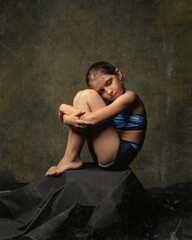 Fototapeta premium Children's portrait in the style of art. On a green canvas in brown tones.