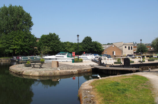 scenic view of brighouse basin with boats and moorings and the lock gates to the calder and hebble navigation canal in west yorkshire