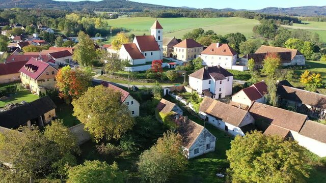 Autumnal aerial landscape of czech village Cakov with Church of Saint Leonard in autumn day