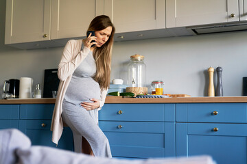 Pregant woman with cramps making call