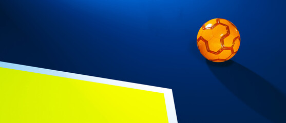 Orange futsal indoor soccer ball laying outside the field with shadow background
