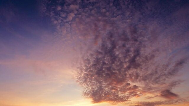 Sunrise or sunset cirrocumulus cloud on red purple sky