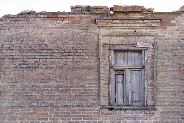 Window on brown brick wall background. Brick wall background