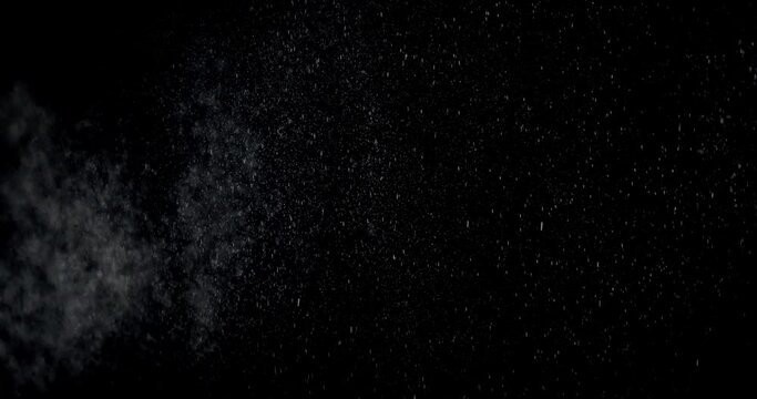 Rain Drops Falling on black background. Slow Rain, Sky Drops. Slow motion of raindrops. Footage is perfect for the layer with different blending modes.