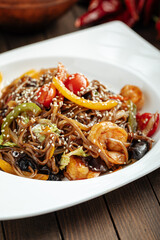 Thai asian soba noodles wok with shrimp and vegetables