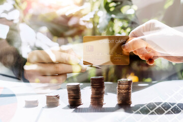 businessman holding coins putting in glass and using calculator. concept saving money and finance accounting.