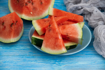 pieces of fresh watermelon on wooden background