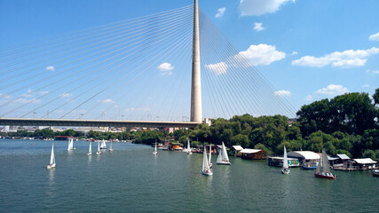 Drone view of bridge, river and boats at summertime - Belgrade, Serbia.