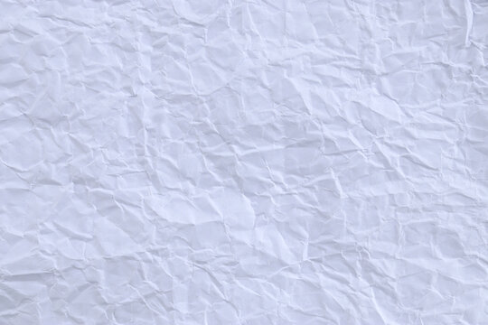 White Crumpled Paper Texture Background. Crush Paper So That It Becomes Creased And Wrinkled.