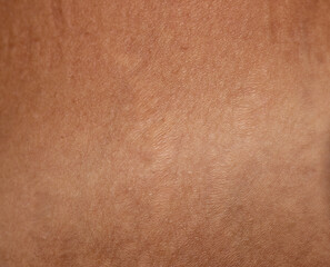 contrast of tanned and fair skin as background