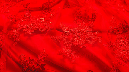 abstract background. red luxury satin fabric with guipure texture. elegant wallpaper desing