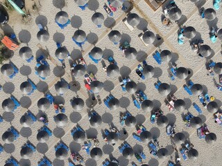 Fototapeta premium Aerial view of kanali beach crowded with tourists, famous tourist destination in preveza, epirus, greece