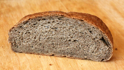 Rye bread on a wooden cutting board, wholemeal bread, brown bread

