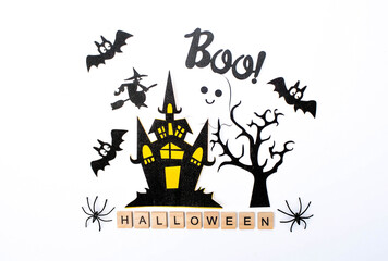 Banner. Modern background with black bats, pumpkins, leaves, cobwebs, spiders, witches and a scary castle on an white background. Halloween with copy space for text. Flat lay, top.