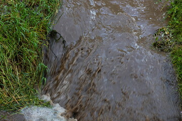 powerful waterfall with dirty water after the hard rain