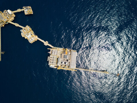 Central processing platform (cpp) in the middle of the ocean on sunny day - upstream industry.